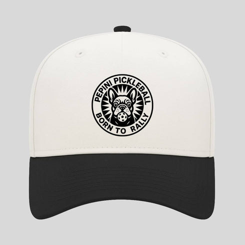 White and black cap with a pickleball logo on a gray background